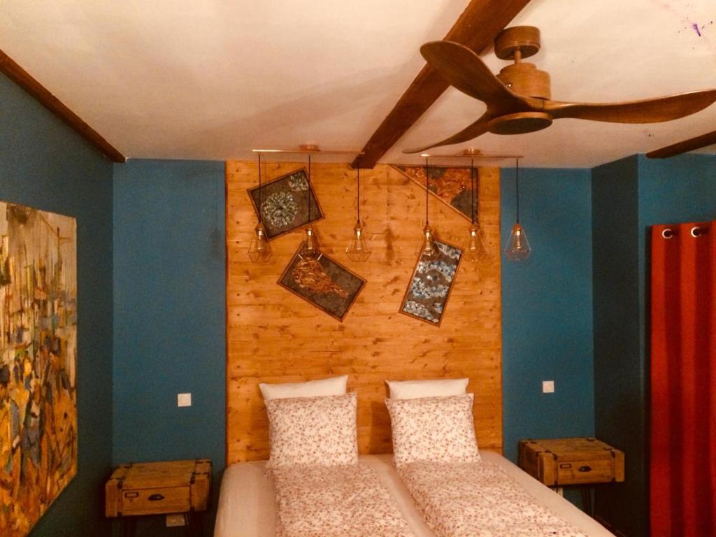 Postel nebo postele na pokoji v ubytování Moulin A