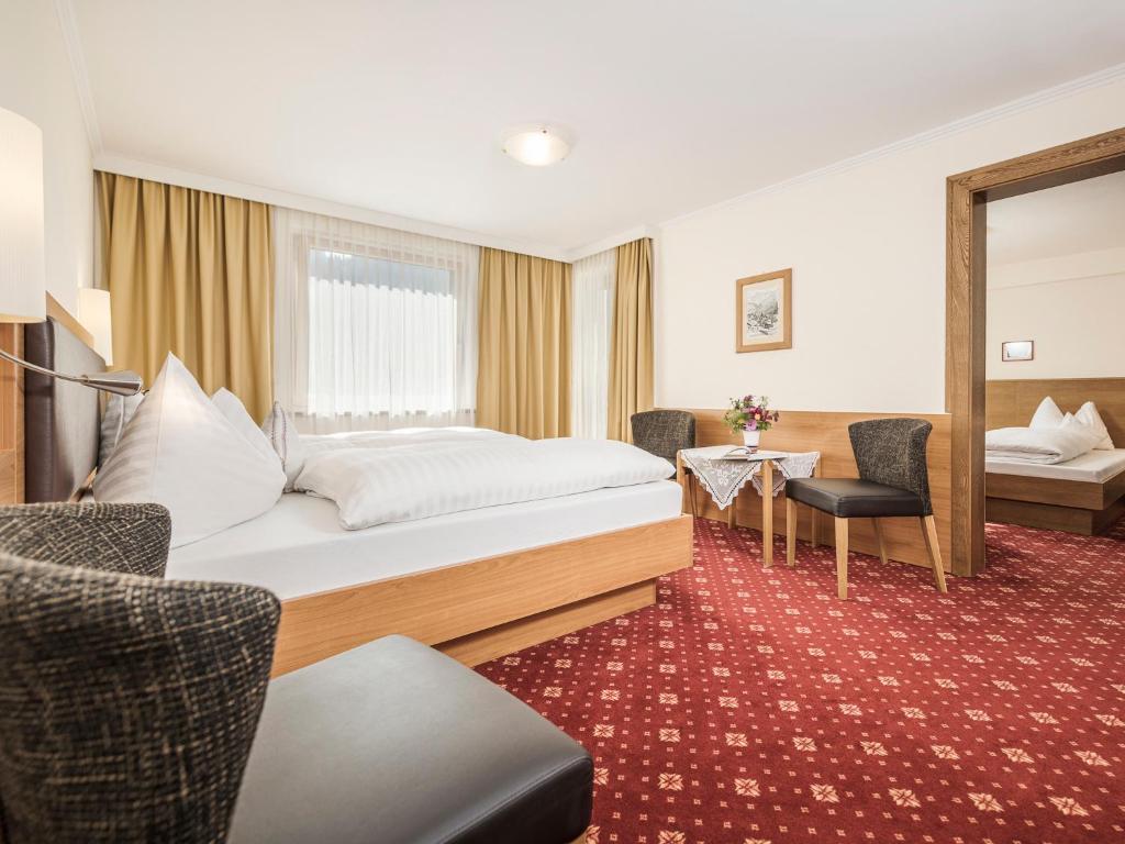 Postel nebo postele na pokoji v ubytování Hotel Finkenbergerhof