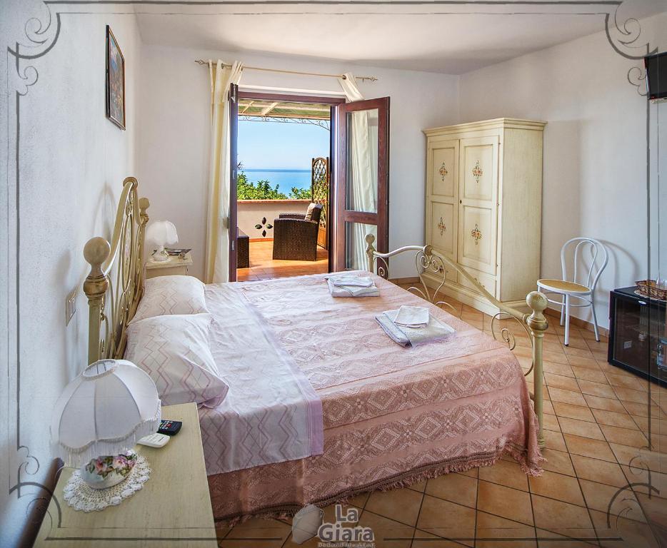 Postel nebo postele na pokoji v ubytování B&b La Giara