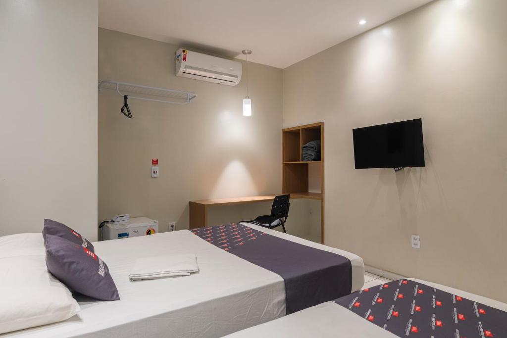 Postel nebo postele na pokoji v ubytování Mega Aeroporto Hotel Apenas 1 km de distância do Aeroporto de Fortaleza