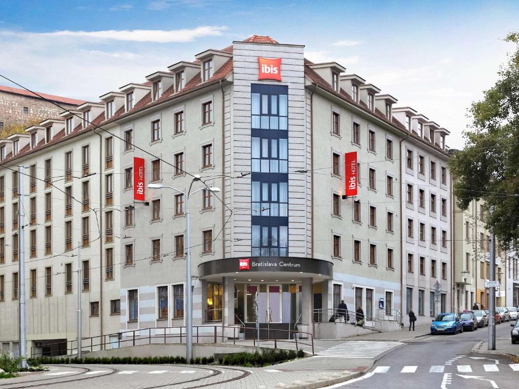 a large building with a clock on the front of it at Ibis Bratislava Centrum in Bratislava