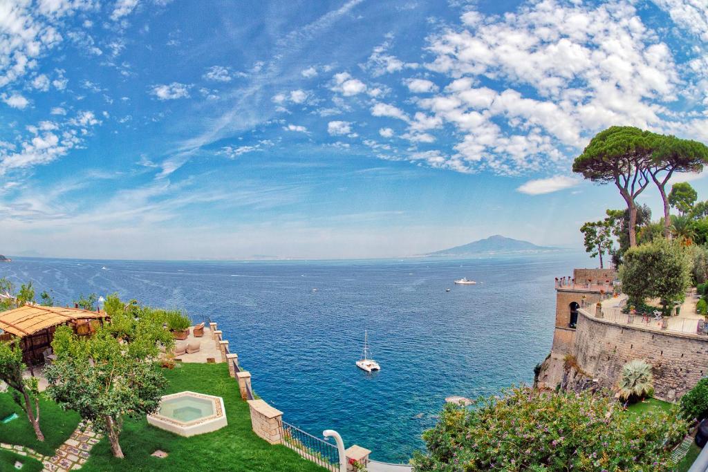 a view of the ocean from a mansion at Amore Rentals - Villa Galidia in Sorrento
