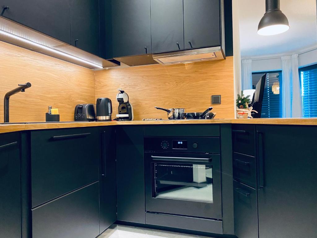 Kuchyňa alebo kuchynka v ubytovaní Apartament Krzysztofa Bochusa