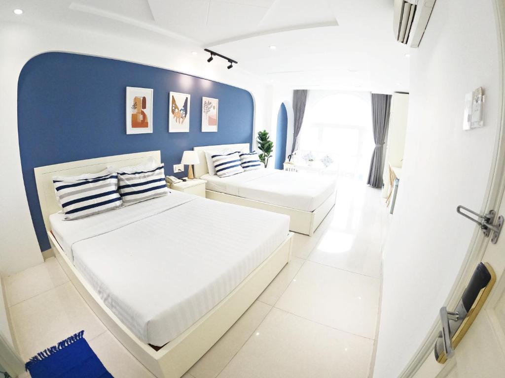 Postel nebo postele na pokoji v ubytování Dinh Phat Hotel