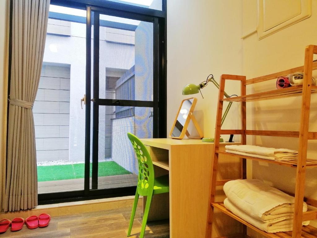 Postel nebo postele na pokoji v ubytování See U Tainan Apartment