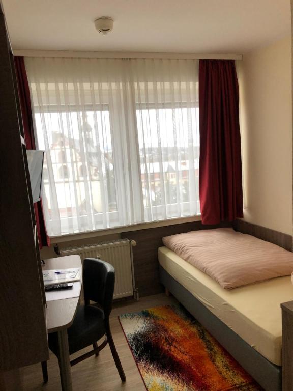 Voodi või voodid majutusasutuse Hotel Peterchens Mondfahrt toas