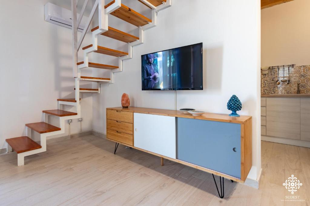 TV a/nebo společenská místnost v ubytování Beach Front Villas