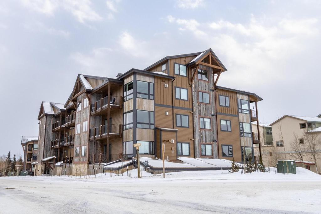 an apartment building with snow on the ground at Sail Lofts by Summit County Mountain Retreats in Dillon