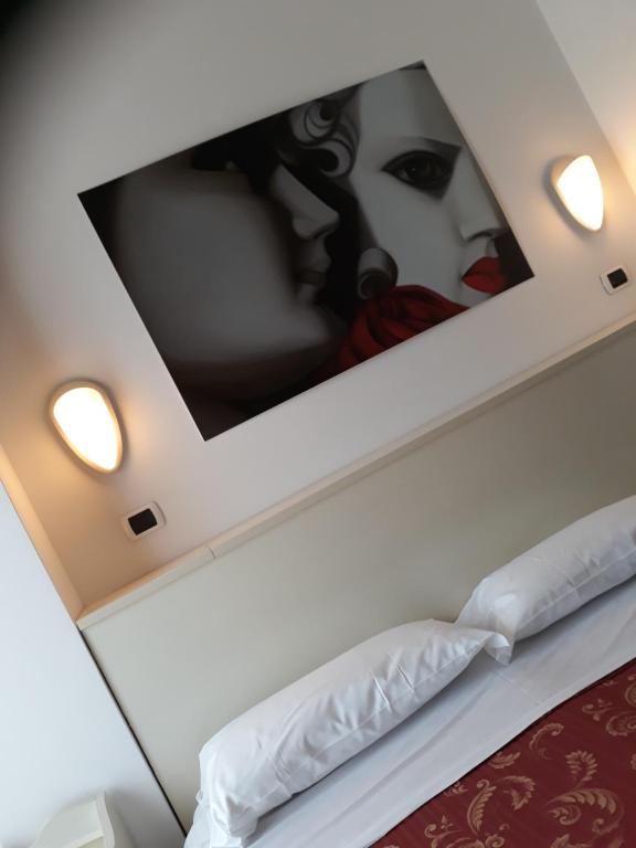 Łóżko lub łóżka w pokoju w obiekcie Hotel La Palazzina
