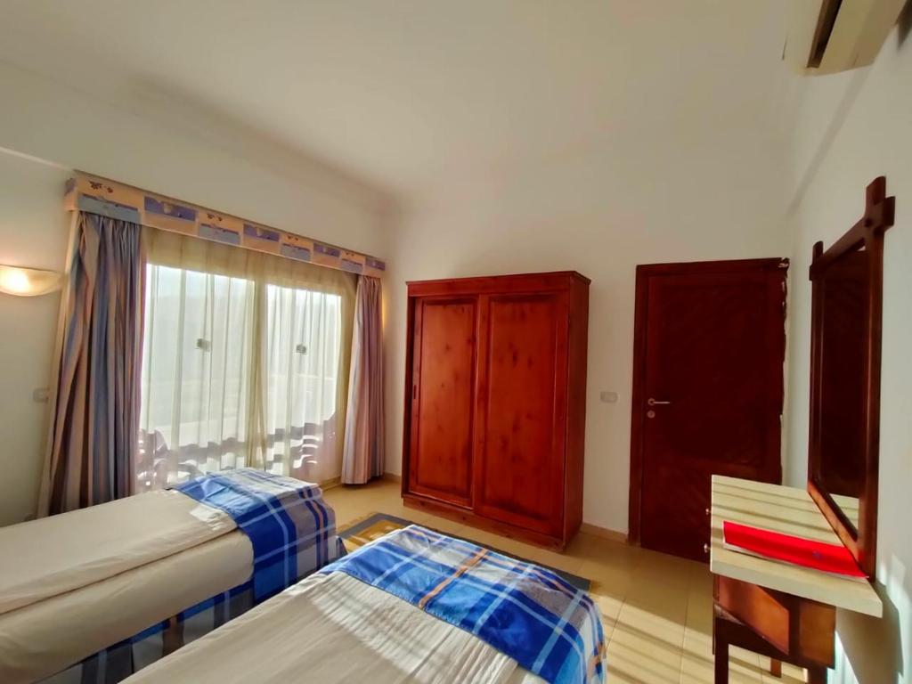 Postel nebo postele na pokoji v ubytování 4S Hotel Dahab