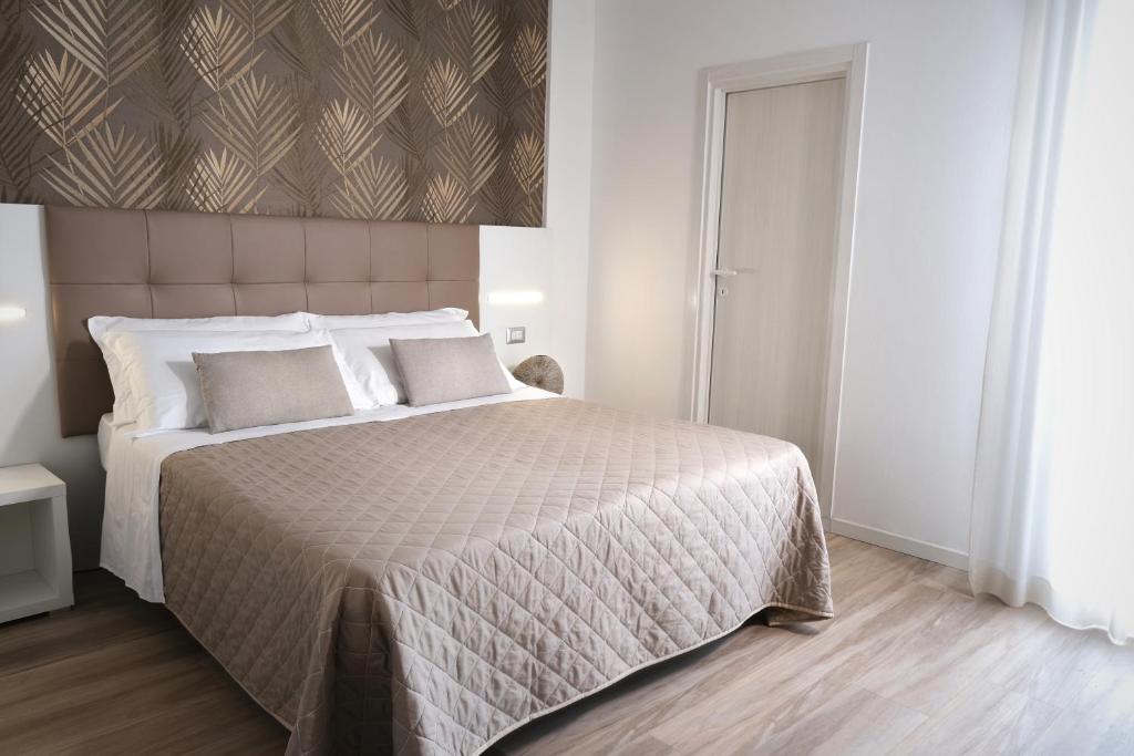Postel nebo postele na pokoji v ubytování Hotel Continental