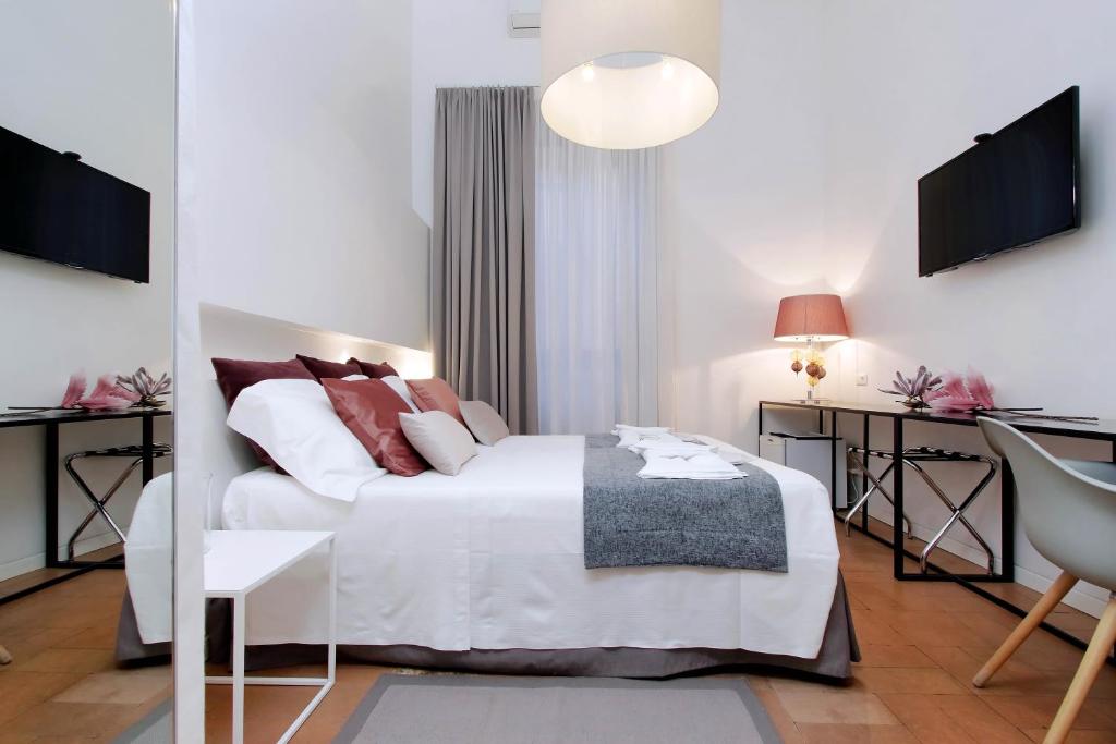 Posteľ alebo postele v izbe v ubytovaní B&G Navona Apartment