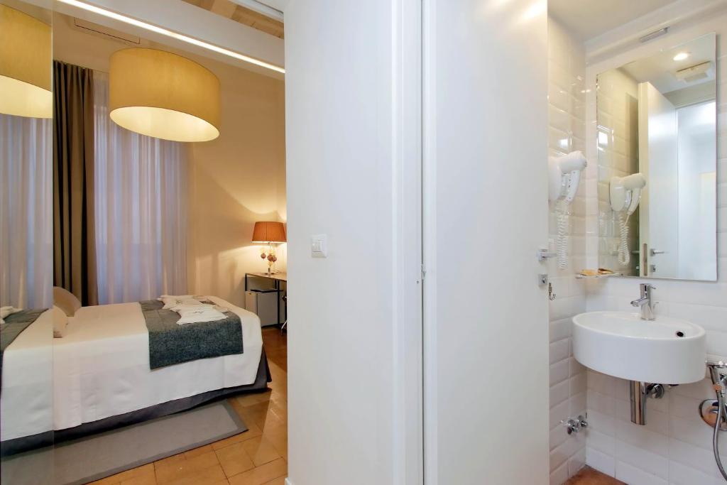Posteľ alebo postele v izbe v ubytovaní B&G Navona Apartment
