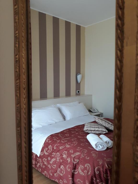 Łóżko lub łóżka w pokoju w obiekcie Hotel La Palazzina