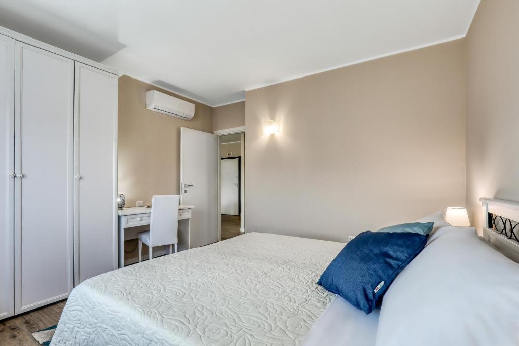Postel nebo postele na pokoji v ubytování Asso Residence Ospedale