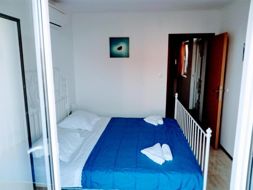 Posteľ alebo postele v izbe v ubytovaní Apartments Karoma