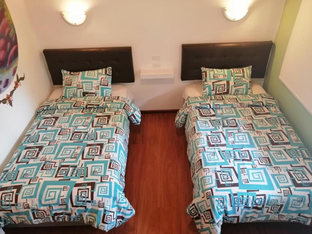 Postel nebo postele na pokoji v ubytování Hostal & Spa Casa Real