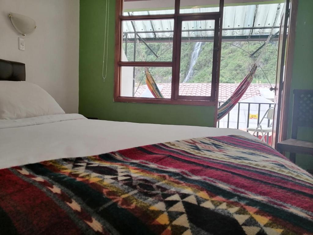 Postel nebo postele na pokoji v ubytování Hostal & Spa Casa Real