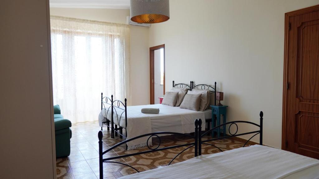 Posteľ alebo postele v izbe v ubytovaní B&B La Veranda