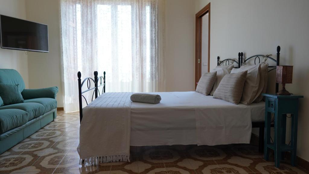 Posteľ alebo postele v izbe v ubytovaní B&B La Veranda