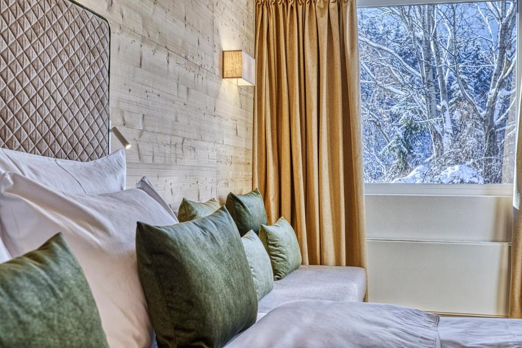 Postel nebo postele na pokoji v ubytování Hotel Pustertalerhof