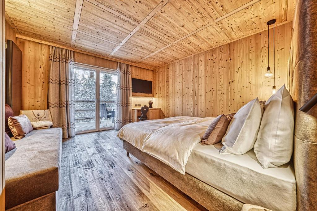 Postel nebo postele na pokoji v ubytování Hotel Pustertalerhof