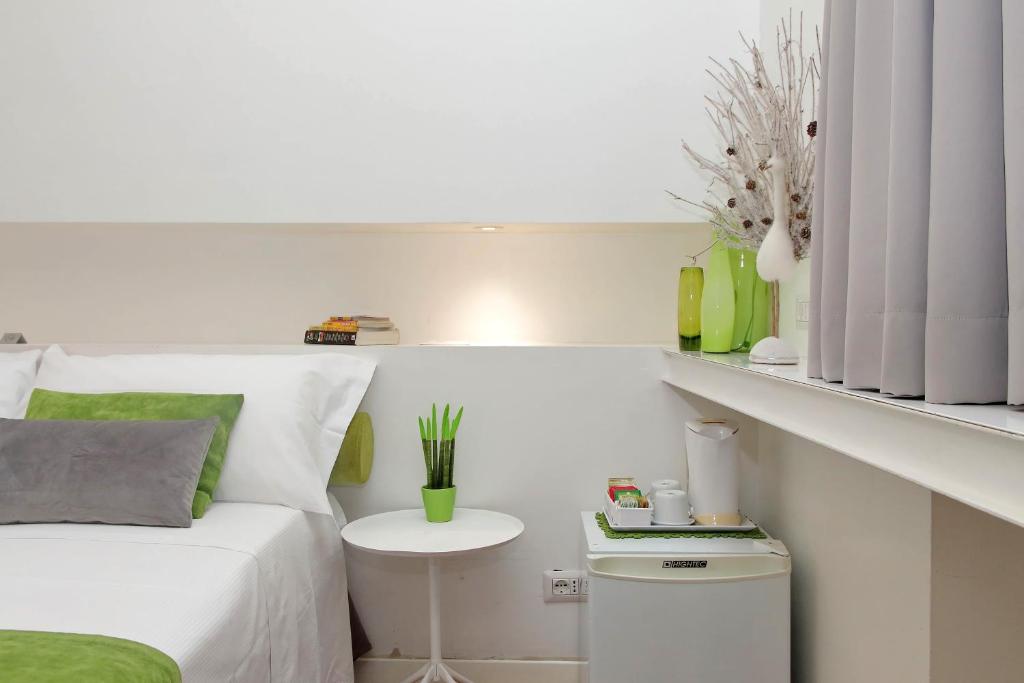 Posteľ alebo postele v izbe v ubytovaní B&G Navona Apartment