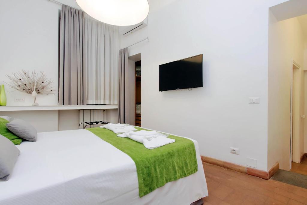 Posteľ alebo postele v izbe v ubytovaní B&G Navona Apartment