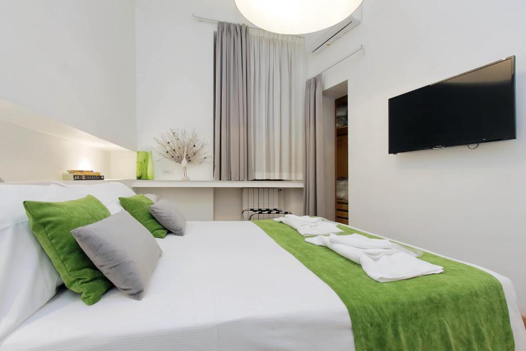 Posteľ alebo postele v izbe v ubytovaní B&G Navona Apartment