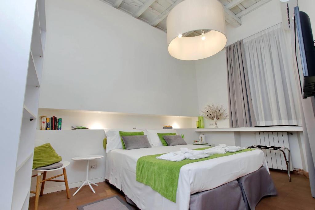 Posteľ alebo postele v izbe v ubytovaní B&G Navona Apartment