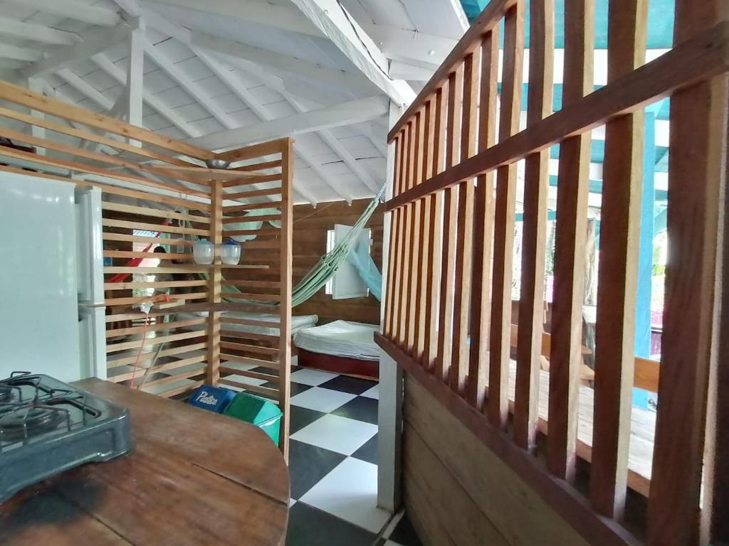 a room with wooden stairs in a house at Hospedaje Pirata Express in Capurganá