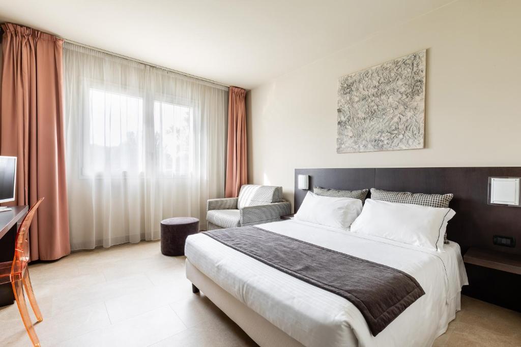 Łóżko lub łóżka w pokoju w obiekcie Anusca Palace Hotel
