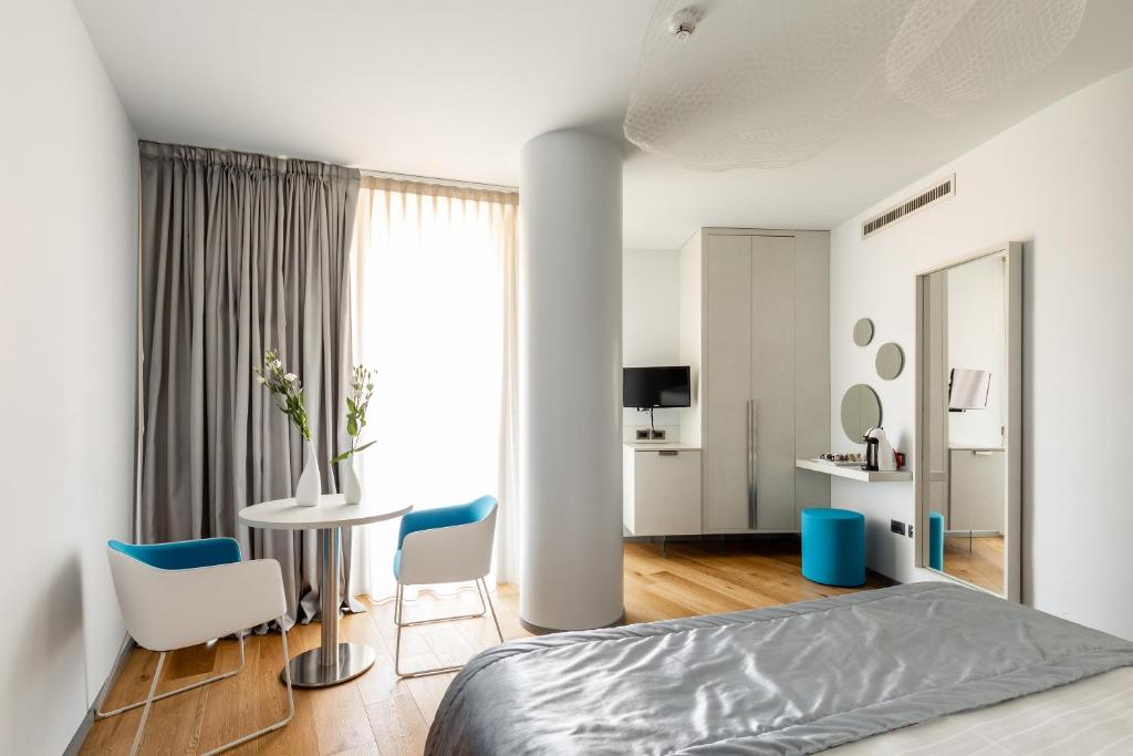 Łóżko lub łóżka w pokoju w obiekcie Anusca Palace Hotel