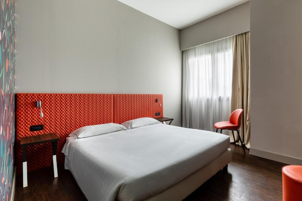 Łóżko lub łóżka w pokoju w obiekcie Anusca Palace Hotel