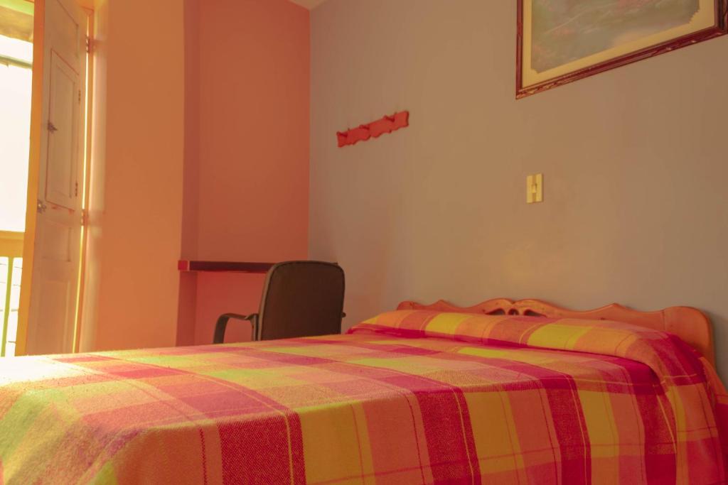 Postel nebo postele na pokoji v ubytování Hotel Felicina