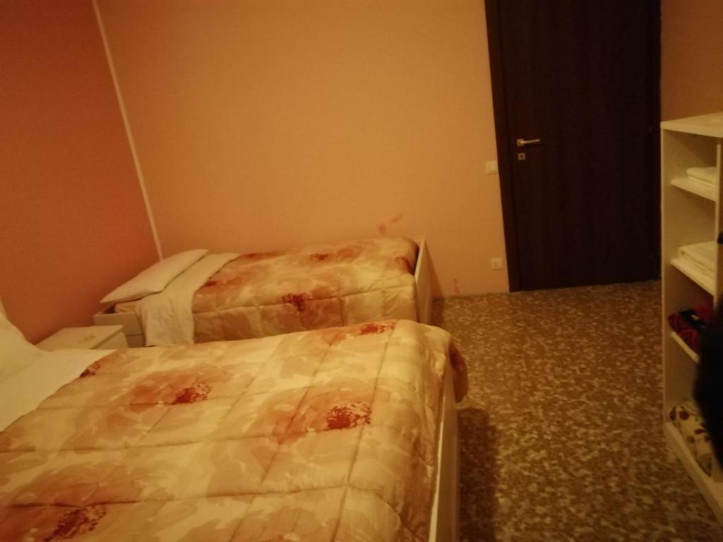 Postel nebo postele na pokoji v ubytování Aeroporto room