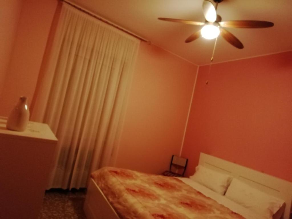 Postel nebo postele na pokoji v ubytování Aeroporto room