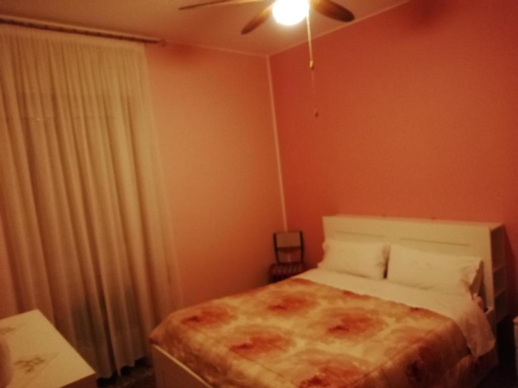 Postel nebo postele na pokoji v ubytování Aeroporto room