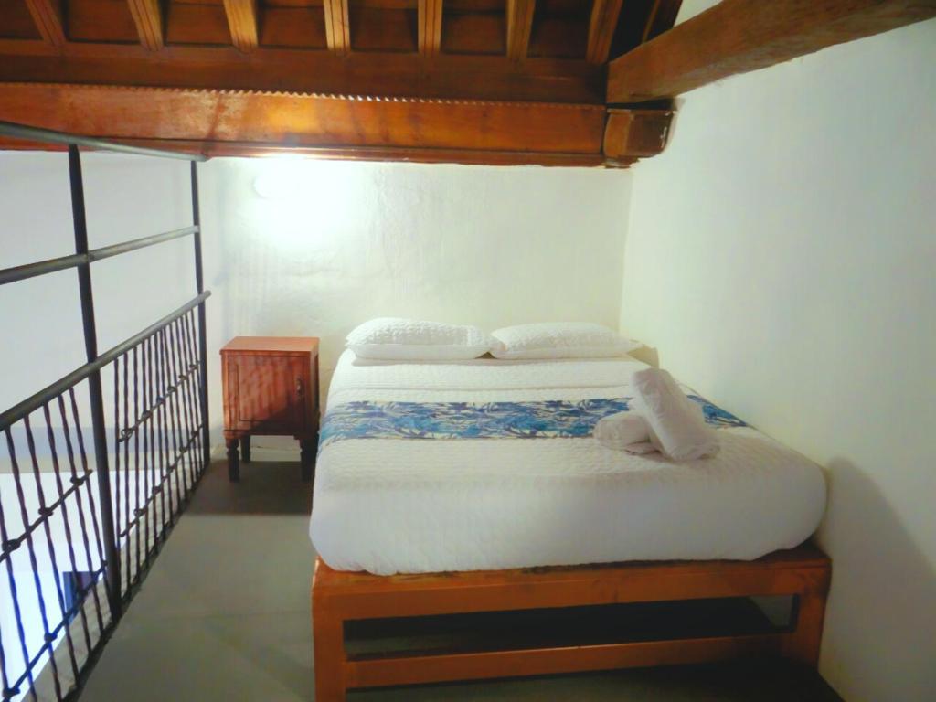Postel nebo postele na pokoji v ubytování Cartagena Legends
