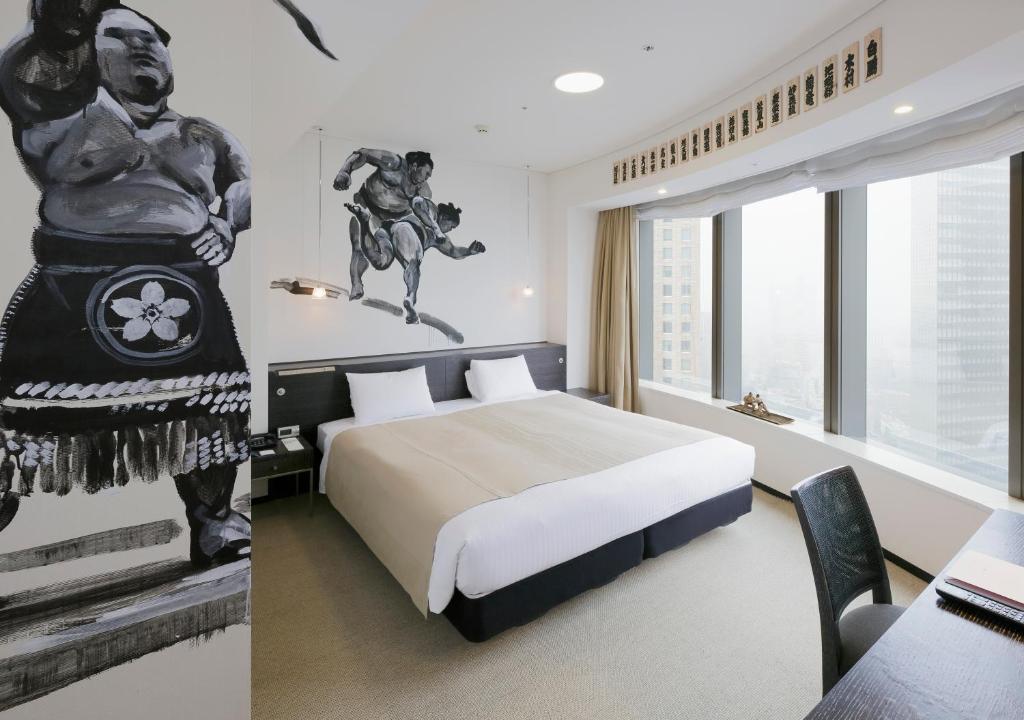 Postel nebo postele na pokoji v ubytování Park Hotel Tokyo