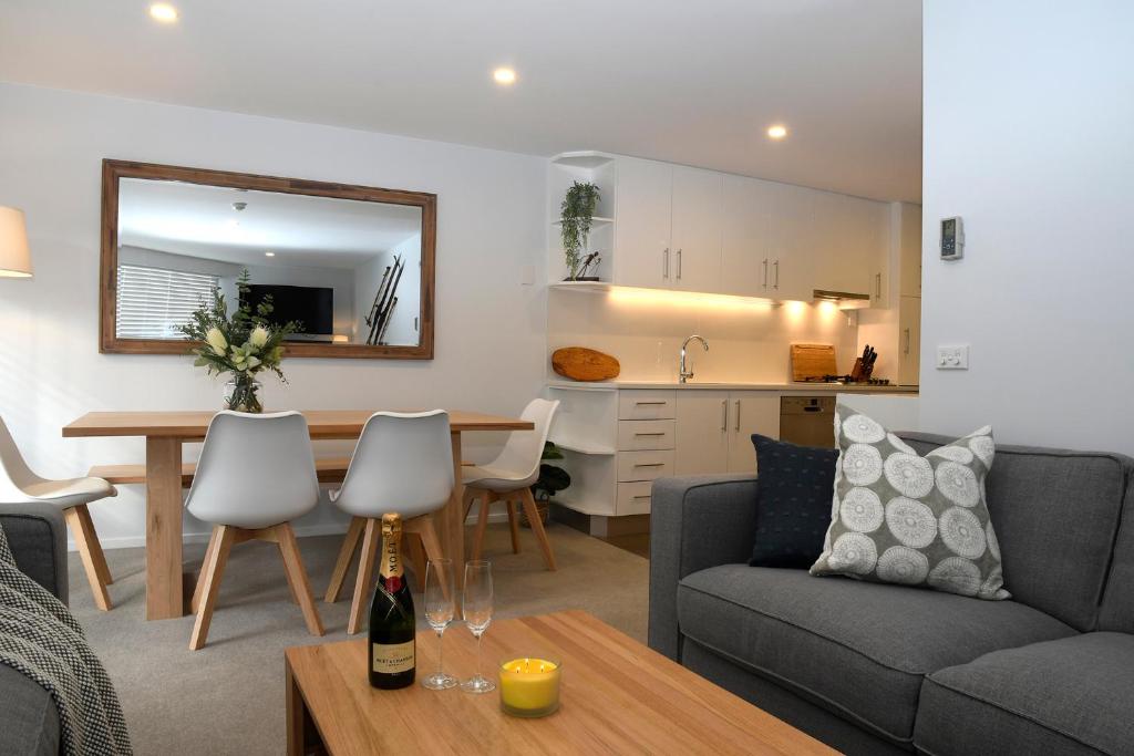 a living room with a couch and a table at Steamboat Unit 1 in Thredbo