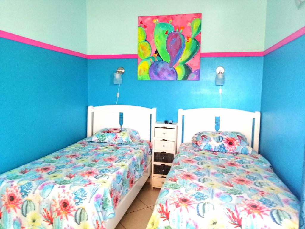 Posteľ alebo postele v izbe v ubytovaní Casa India Dormida