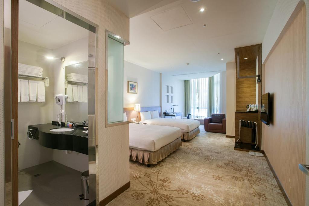 Postel nebo postele na pokoji v ubytování Taisugar Hotel Taipei