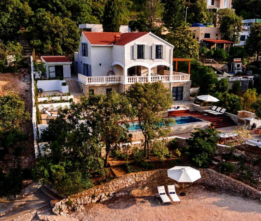 an aerial view of a house with a swimming pool at Villa Waterfront Dream A Stunning 4 Bedroom Villa Cinema Room Wine Cellar in Korčula