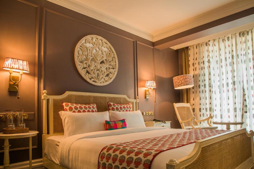Een bed of bedden in een kamer bij Red Thread Calangute