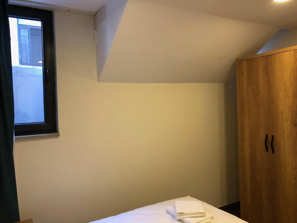 Postel nebo postele na pokoji v ubytování Pege Hotel
