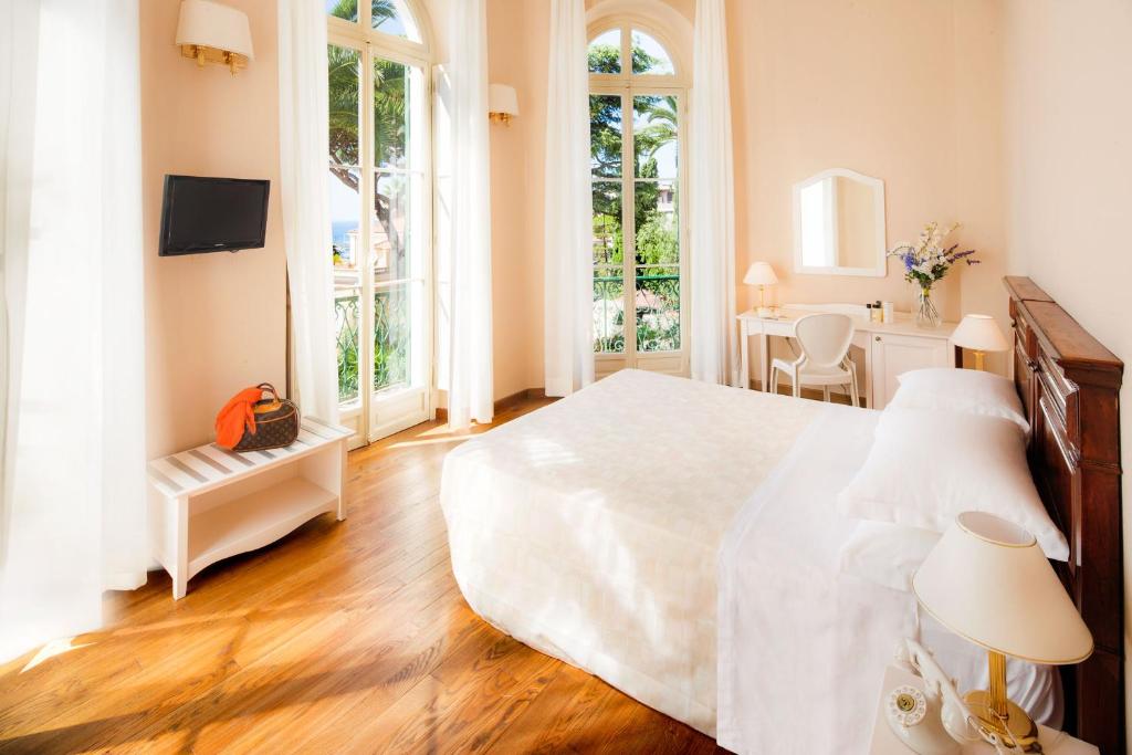 Postel nebo postele na pokoji v ubytování Villa Sylva & Spa