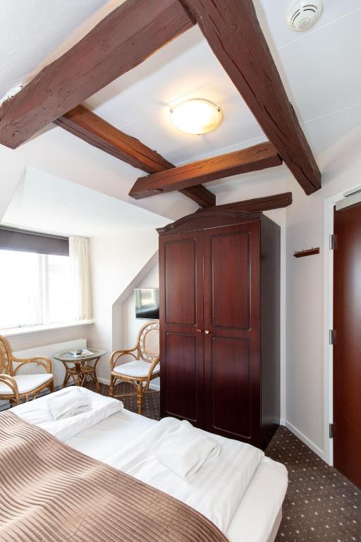 Posteľ alebo postele v izbe v ubytovaní Foldens Hotel