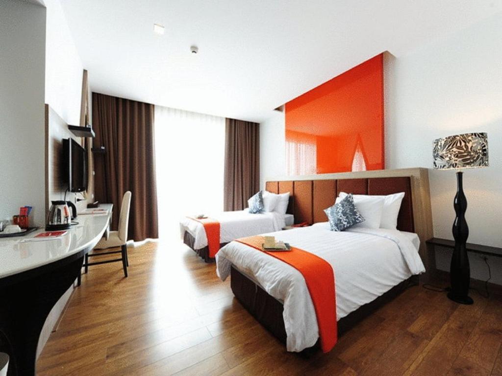 Postel nebo postele na pokoji v ubytování Prajaktra Design Hotel