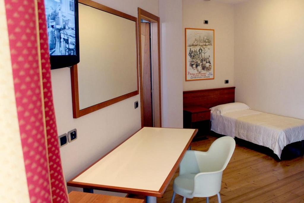 Postel nebo postele na pokoji v ubytování Hotel Rubicone